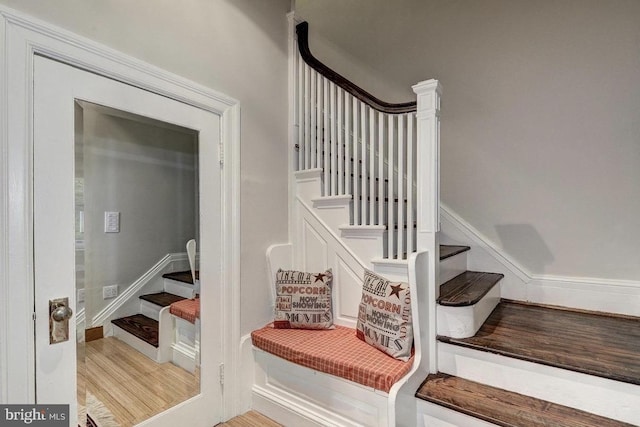 stairway with wood finished floors