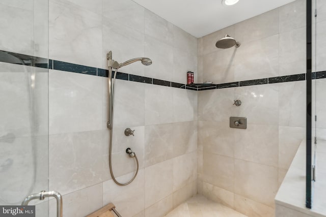 full bath with a shower stall