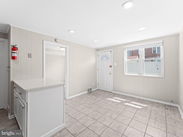 interior space featuring recessed lighting, visible vents, baseboards, and light tile patterned floors