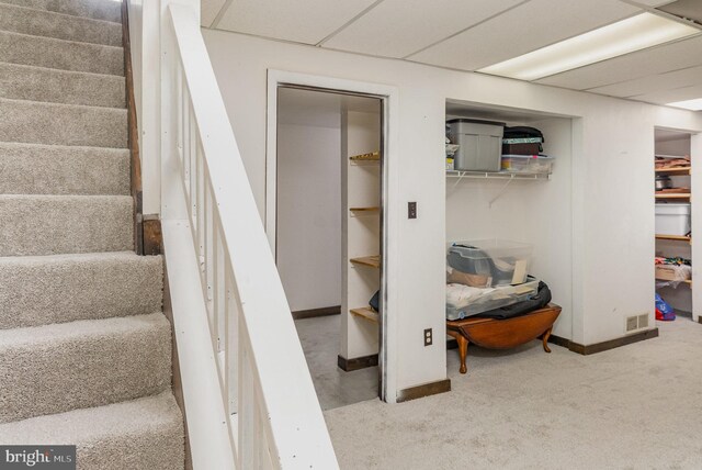 staircase with carpet floors and baseboards