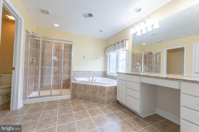 9184 Laurel Highlands Pl, Manassas, VA 20112 - full bath with vanity, tile patterned flooring, a bath, a shower stall, and toilet