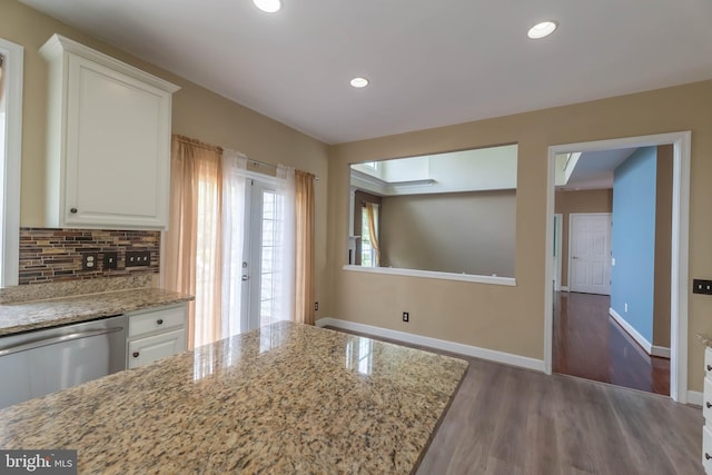9184 Laurel Highlands Pl, Manassas, VA 20112 - kitchen featuring dishwasher, wood finished floors, white cabinets, backsplash, and recessed lighting