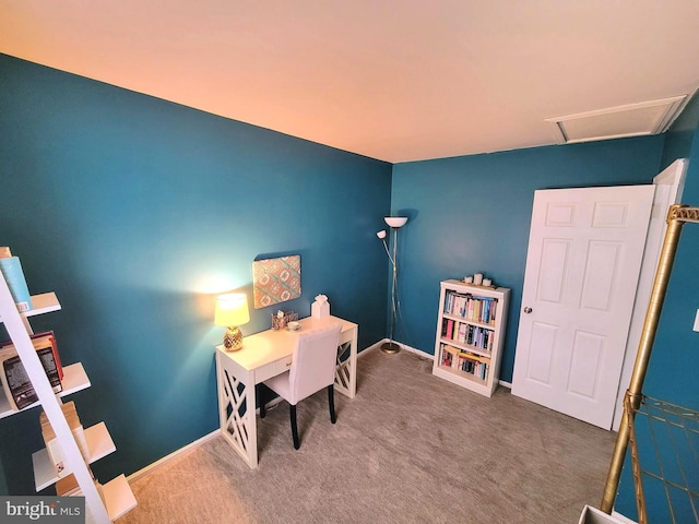 carpeted home office featuring baseboards