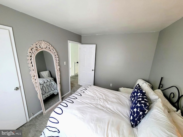carpeted bedroom with baseboards