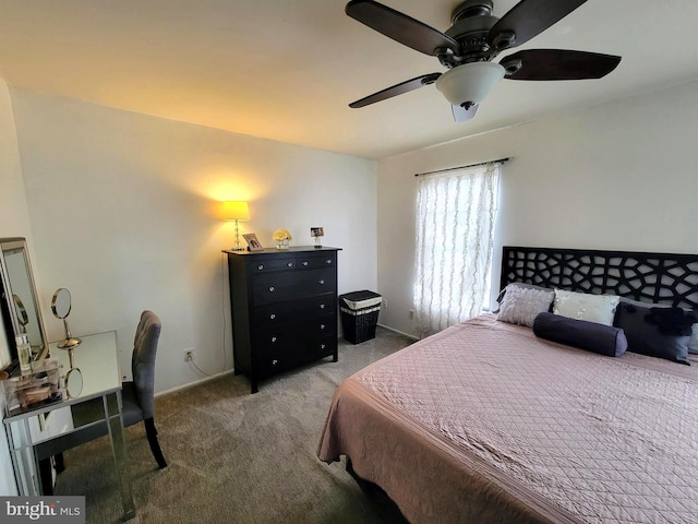 carpeted bedroom featuring baseboards and a ceiling fan