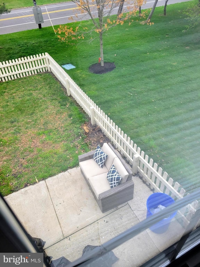 view of yard featuring fence and a patio