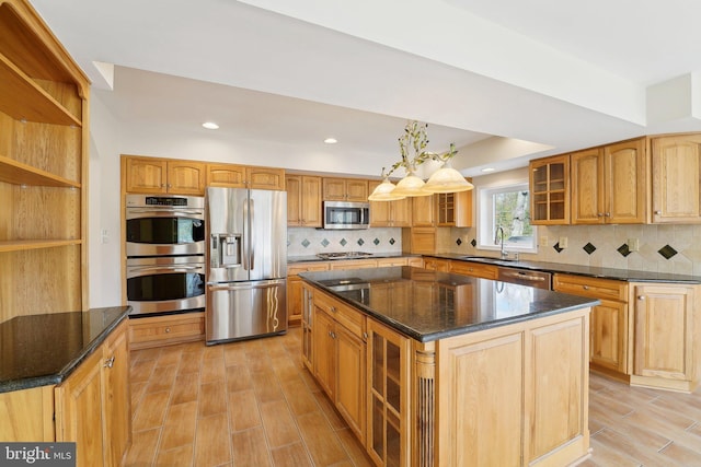 264 Capote Ct E, Severna Park, MD 21146 - kitchen with appliances with stainless steel finishes, a sink, a kitchen island, wood finish floors, and glass insert cabinets