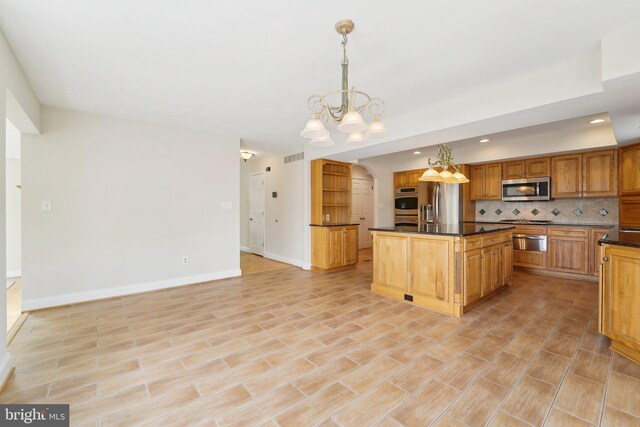 264 Capote Ct E, Severna Park, MD 21146 - kitchen with appliances with stainless steel finishes, a chandelier, a warming drawer, dark countertops, and decorative backsplash