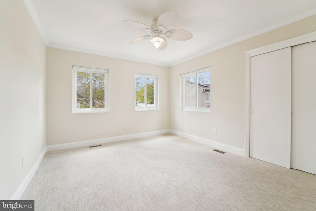264 Capote Ct E, Severna Park, MD 21146 - unfurnished bedroom with crown molding, carpet flooring, baseboards, ceiling fan, and a closet