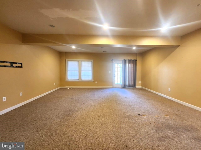 carpeted empty room featuring baseboards and recessed lighting