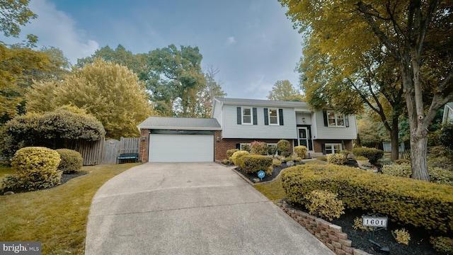 1601 Jubilation Ct, Herndon, VA 20170 - split foyer home featuring fence, driveway, brick siding, and a garage