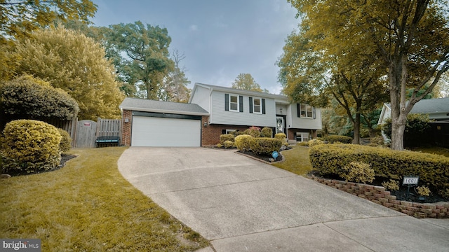 1601 Jubilation Ct, Herndon, VA 20170 - split foyer home with concrete driveway, brick siding, and a garage