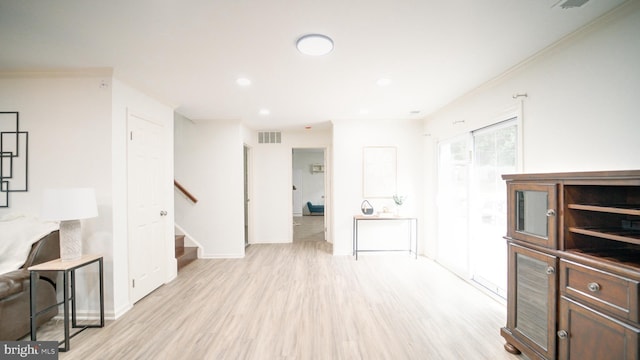 1601 Jubilation Ct, Herndon, VA 20170 - unfurnished living room featuring light wood finished floors, stairway, baseboards, and recessed lighting