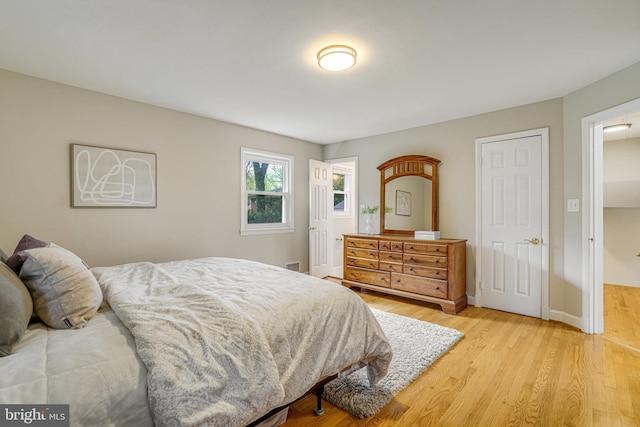 6515 Walters Woods Dr, Falls Church, VA 22044 - bedroom with baseboards and light wood finished floors