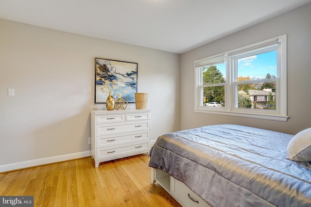 6515 Walters Woods Dr, Falls Church, VA 22044 - bedroom featuring baseboards and light wood-style flooring