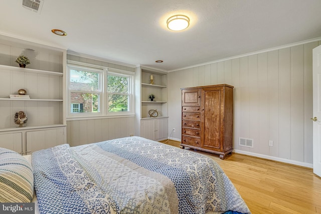 6515 Walters Woods Dr, Falls Church, VA 22044 - bedroom featuring baseboards, ornamental molding, visible vents, and light wood-type flooring