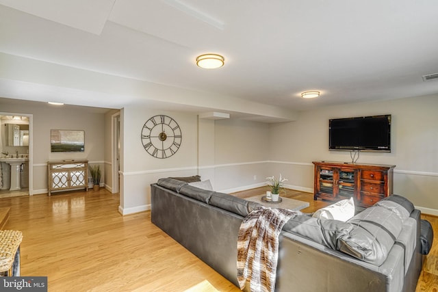 6515 Walters Woods Dr, Falls Church, VA 22044 - living area with baseboards, visible vents, and light wood-style flooring
