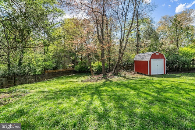 6515 Walters Woods Dr, Falls Church, VA 22044 - view of yard featuring a fenced backyard, an outbuilding, and a storage unit
