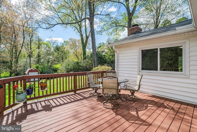 6515 Walters Woods Dr, Falls Church, VA 22044 - wooden terrace with an outdoor structure, outdoor dining area, and a shed