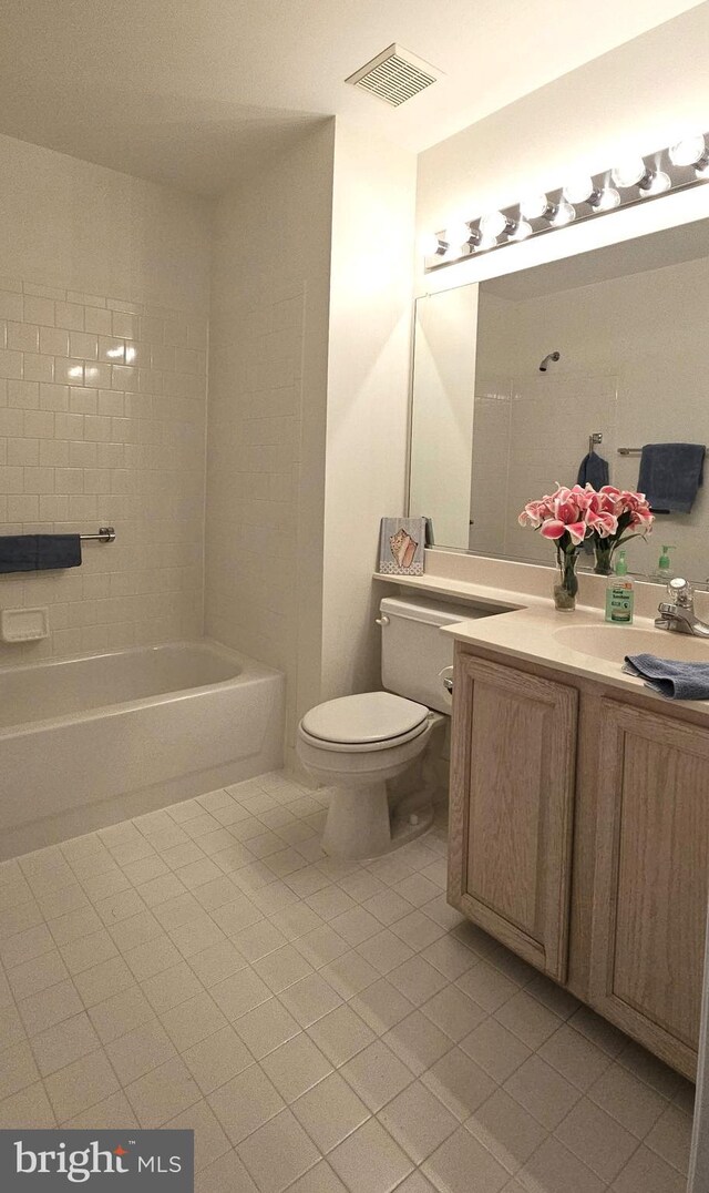 full bath with tile patterned flooring, vanity, a bathing tub, toilet, and visible vents
