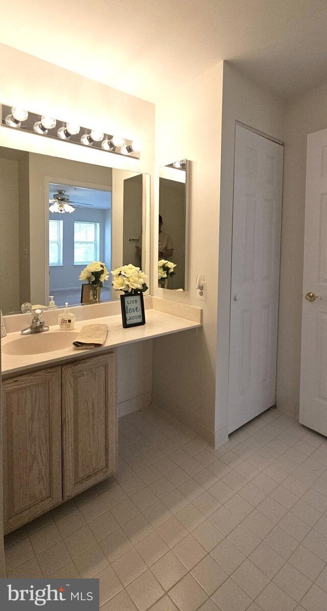 bathroom with vanity and tile patterned flooring