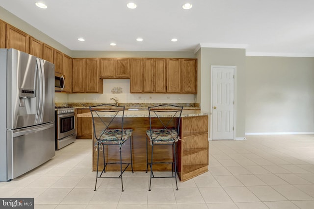 kitchen featuring crown molding, recessed lighting, light stone counters, and stainless steel appliances
