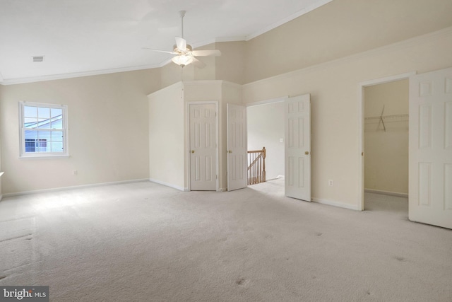 unfurnished bedroom with visible vents, baseboards, crown molding, and carpet floors