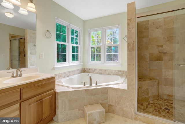 full bath with a shower stall, tile patterned flooring, vanity, and a garden tub