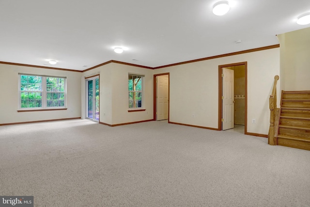 unfurnished living room with light carpet, stairs, baseboards, and ornamental molding