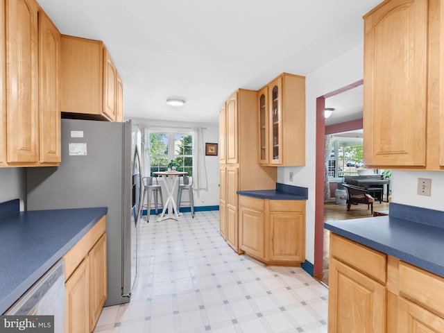 600 Maplewood Rd, Springfield, PA 19064 - kitchen featuring light brown cabinetry, a healthy amount of sunlight, glass insert cabinets, light floors, and dishwasher
