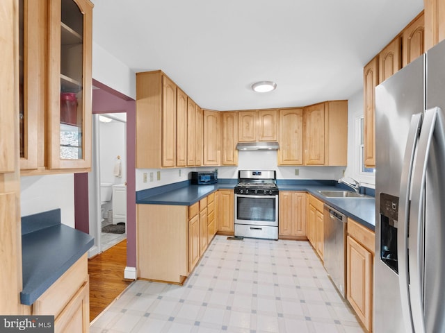 600 Maplewood Rd, Springfield, PA 19064 - kitchen with a sink, under cabinet range hood, dark countertops, and stainless steel appliances