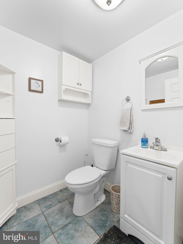 600 Maplewood Rd, Springfield, PA 19064 - half bathroom with toilet, baseboards, tile patterned flooring, and vanity