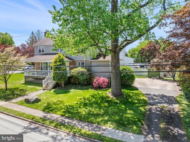 600 Maplewood Rd, Springfield, PA 19064 - obstructed view of property featuring a deck, stairs, and a front yard
