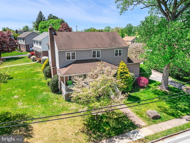 600 Maplewood Rd, Springfield, PA 19064 - view of front of home featuring a chimney and a front lawn