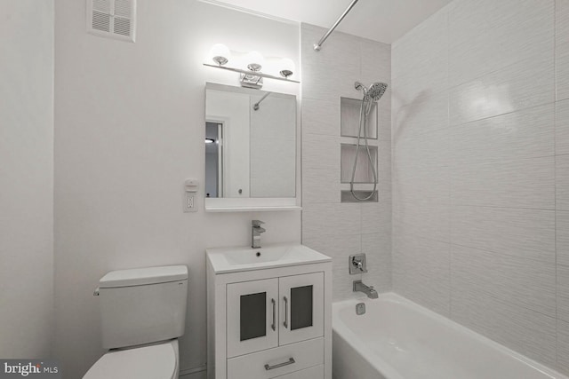 bathroom featuring vanity, visible vents, toilet, and shower / washtub combination