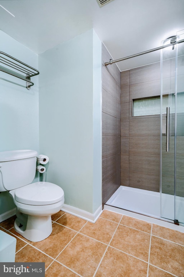 full bathroom featuring visible vents, tile patterned flooring, a shower stall, baseboards, and toilet