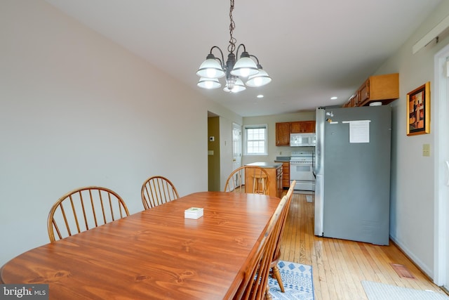 365 Hickory Trl, Crownsville, MD 21032 - dining area featuring light wood-style flooring and an inviting chandelier