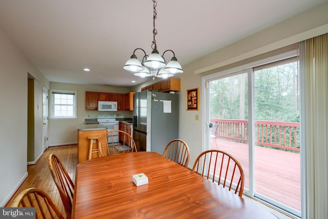 365 Hickory Trl, Crownsville, MD 21032 - dining room with baseboards, light wood-type flooring, an inviting chandelier, and recessed lighting
