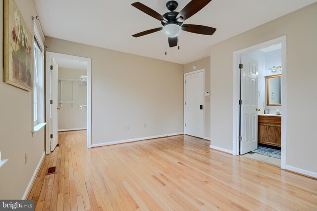 365 Hickory Trl, Crownsville, MD 21032 - unfurnished bedroom with baseboards, ensuite bath, a walk in closet, light wood-style floors, and visible vents