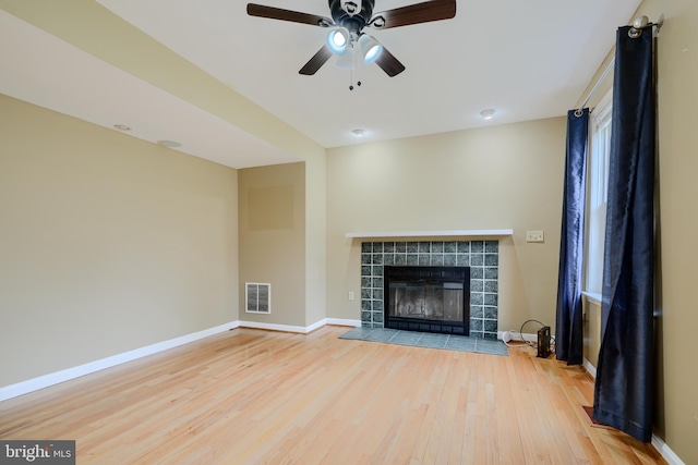 365 Hickory Trl, Crownsville, MD 21032 - unfurnished living room featuring wood finished floors, baseboards, a ceiling fan, and visible vents