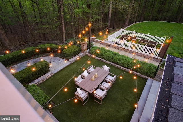 view of yard with fence and a forest view