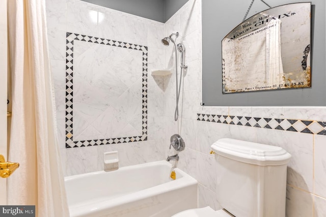 full bathroom featuring wainscoting, toilet, tile walls, and shower / bath combination with curtain