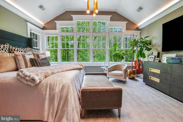 bedroom with multiple windows, lofted ceiling, and visible vents