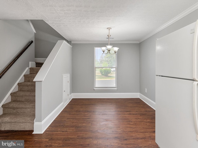 13347 Demetrias Way W, Germantown, MD 20874 - unfurnished dining area with crown molding, an inviting chandelier, stairs, wood finished floors, and a textured ceiling