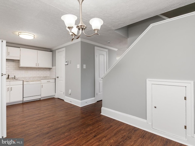 13347 Demetrias Way W, Germantown, MD 20874 - kitchen featuring dishwasher, light countertops, a textured ceiling, a chandelier, and white cabinetry