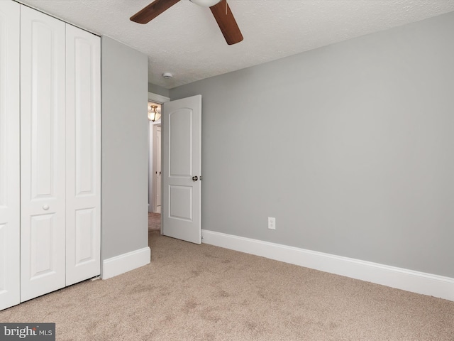 13347 Demetrias Way W, Germantown, MD 20874 - unfurnished bedroom featuring a ceiling fan, a textured ceiling, baseboards, a closet, and carpet