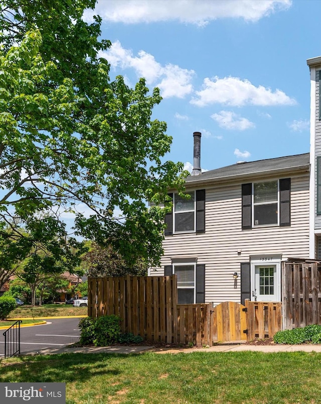13347 Demetrias Way W, Germantown, MD 20874 - rear view of property with fence and a chimney