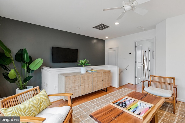 living area featuring ceiling fan, light wood-style flooring, recessed lighting, and baseboards