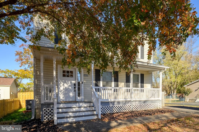 606 Whittington Pl, Deale, MD 20751 - view of property hidden behind natural elements with fence and a porch