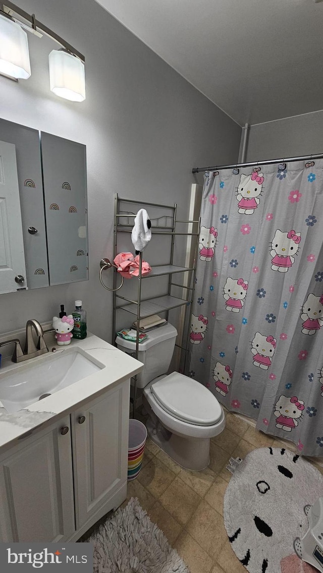 101 Commerce St, Hurlock, MD 21643 - full bathroom featuring a shower with shower curtain, toilet, and vanity